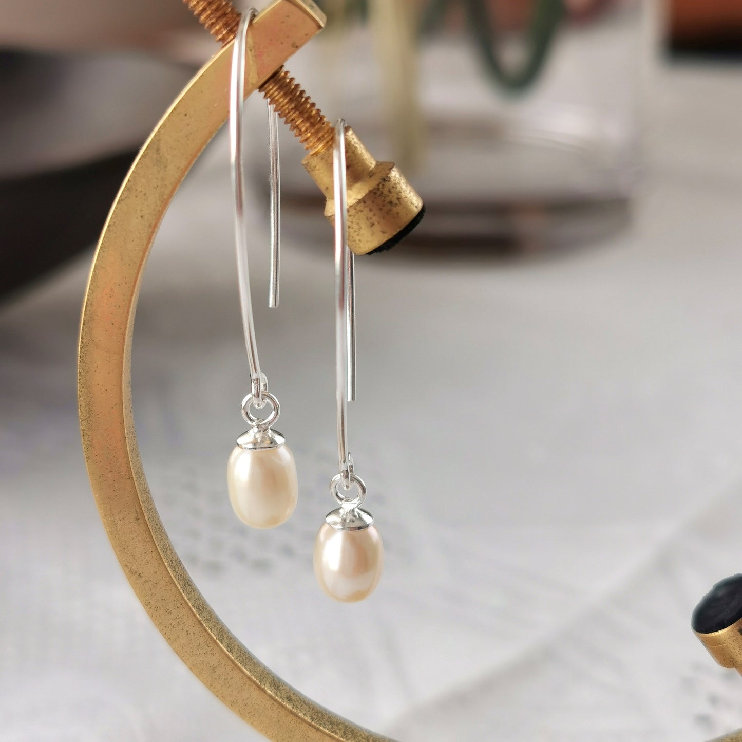 Earrings with small teardrop pearl